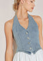 Close up detail of washed denim halter vest bodice with button front