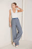 Pinstripe seersucker wide leg pants with denim waistband styled with neutral top