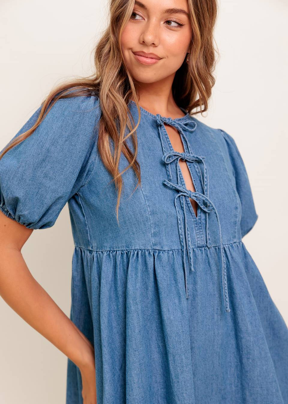 THE ELOWEN BOW-TIE DENIM MINI DRESS