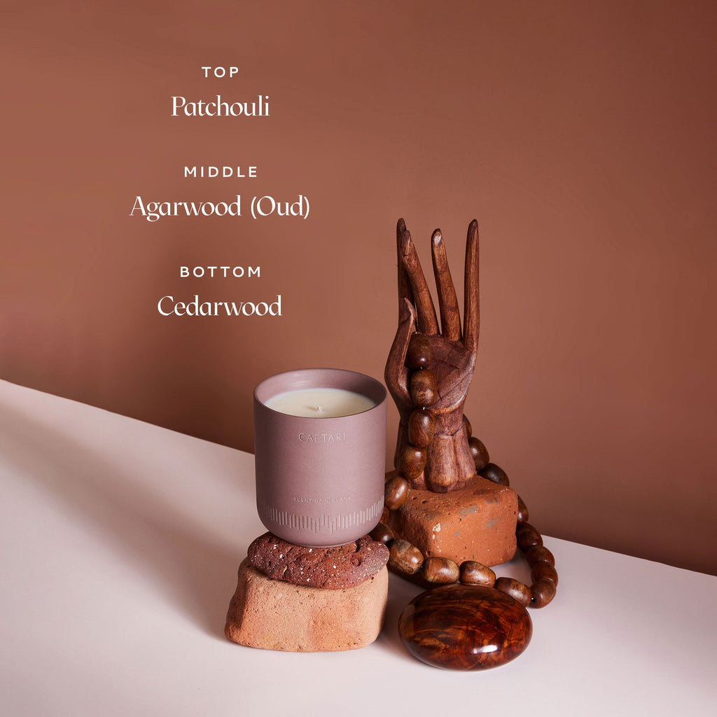Caftari Scent of Nirvana meditation candle featuring patchouli agarwood oud and cedarwood fragrance notes