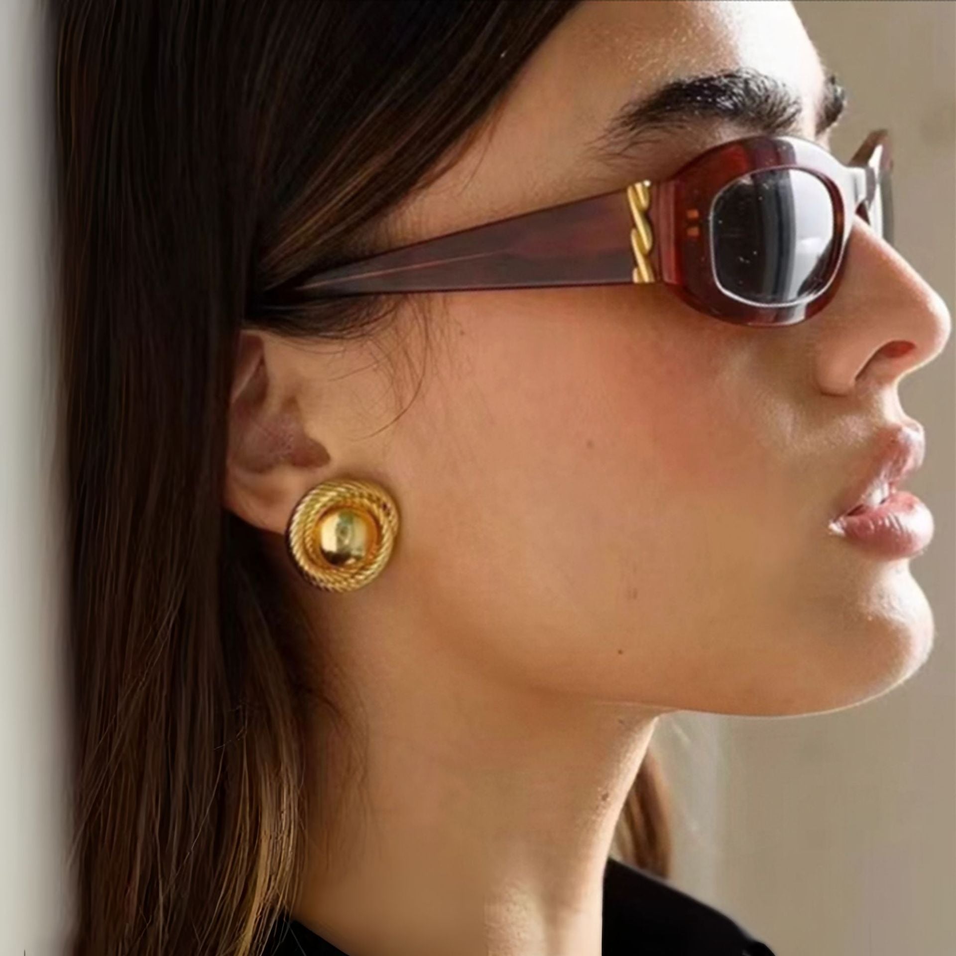 Gold spiral statement stud earrings with textured rope detail Main image