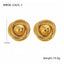 Pair of gold earrings with measurements and weight on a white background
