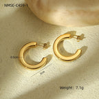 Gold hoop earrings on a textured beige surface with measurements and weight displayed.