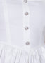Close-up of a white dress with buttons on a white background