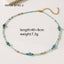 Necklace with blue beads and gold accents on a white background