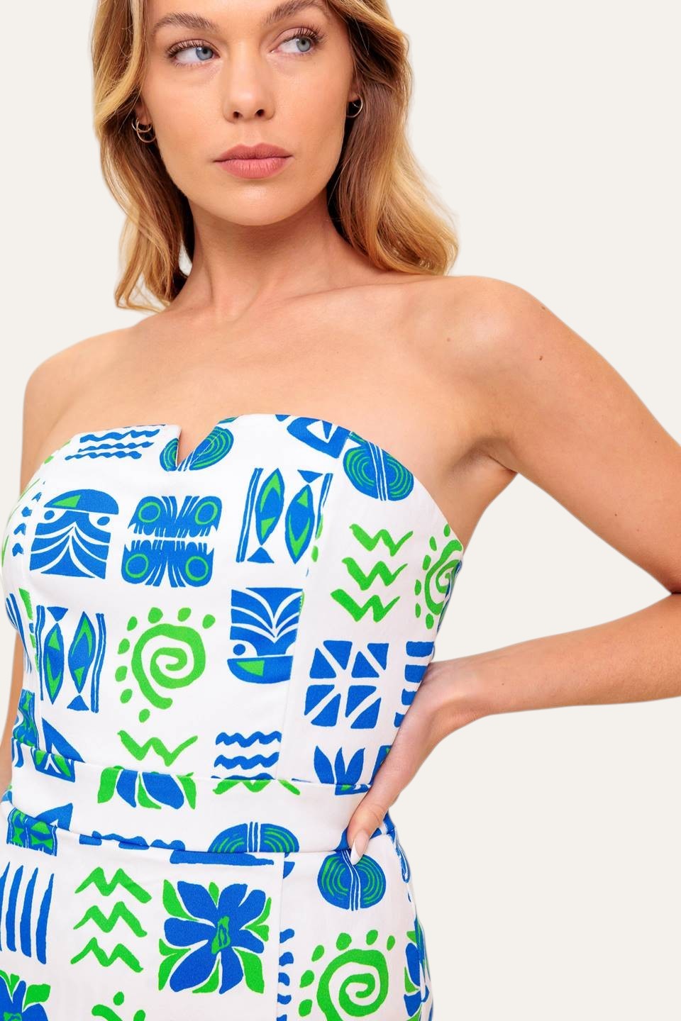 Winged Meadow Co. strapless mini dress with sweetheart neckline and blue & green tribal print. Scalloped trim.