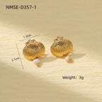 Coastal-inspired shell earrings in gold and silver tones styled flat lay