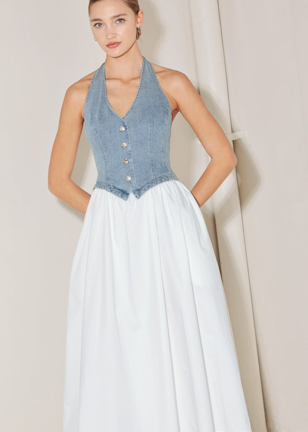 Front view of denim halter vest midi dress with flowing cotton skirt