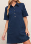 Side view of navy textured knit mini dress with short sleeves and modern silhouette