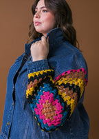 Side view of plus size washed denim jacket with crochet sleeve contrast