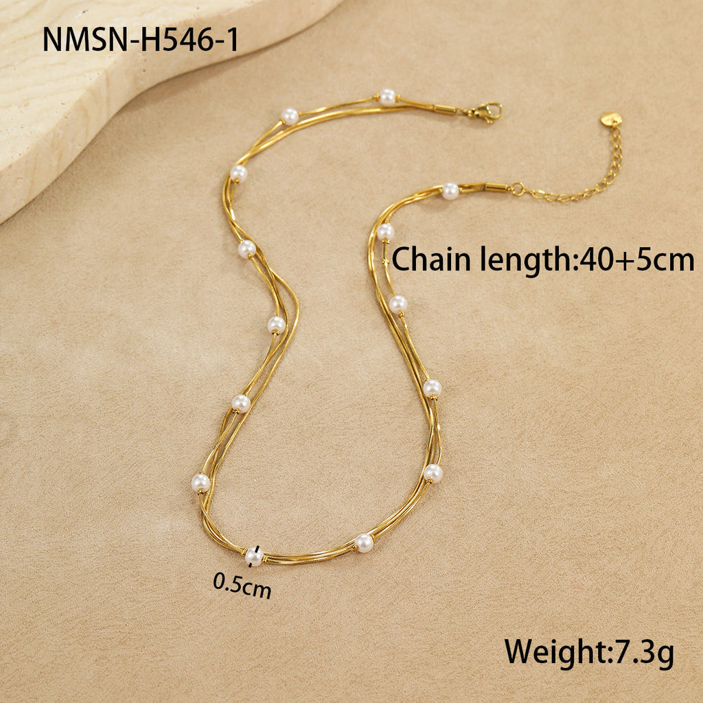 Gold necklace with pearls on a beige background, showing chain length, weight, and measurement details.