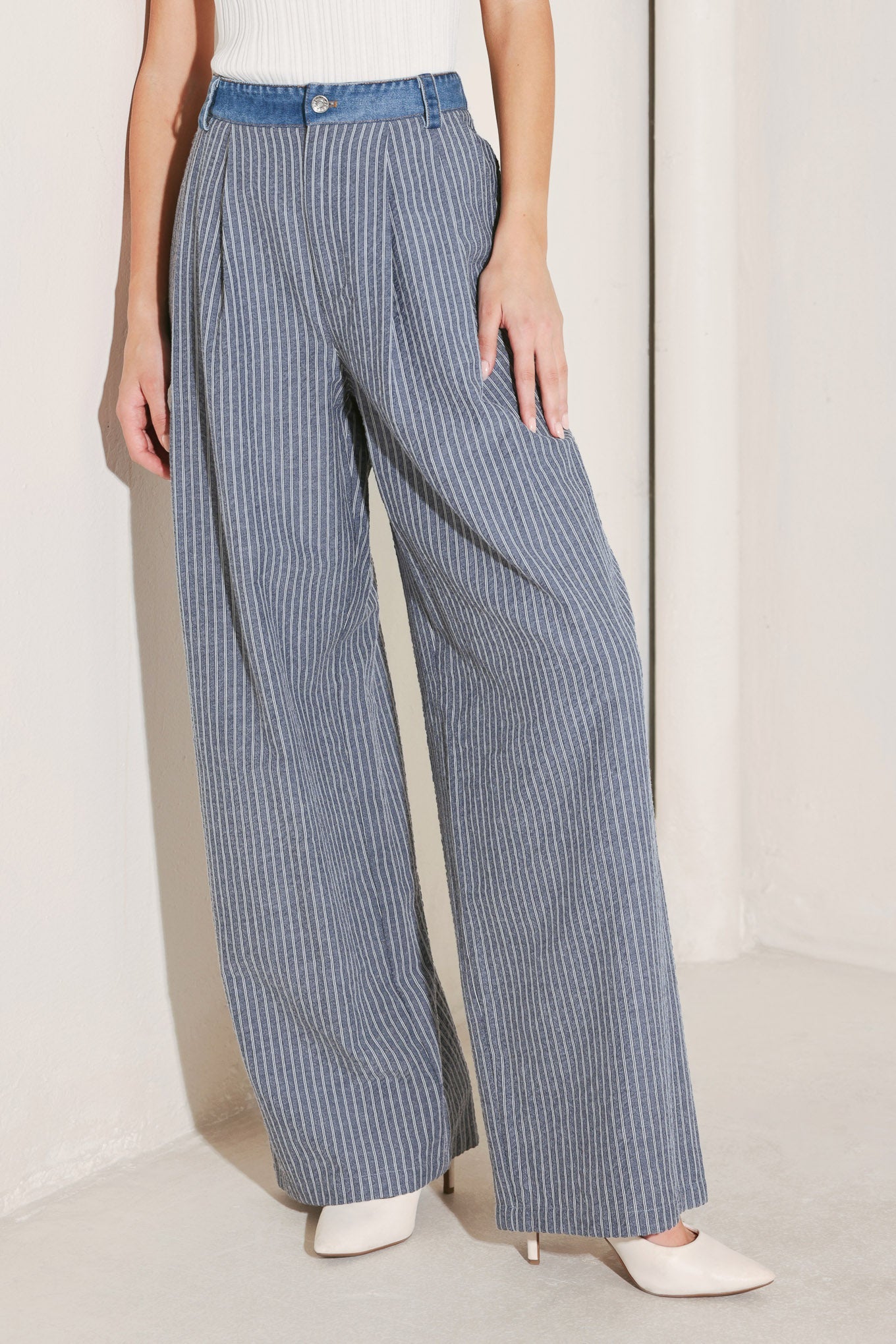 Front view of pinstripe seersucker wide leg pants with contrast denim waistband