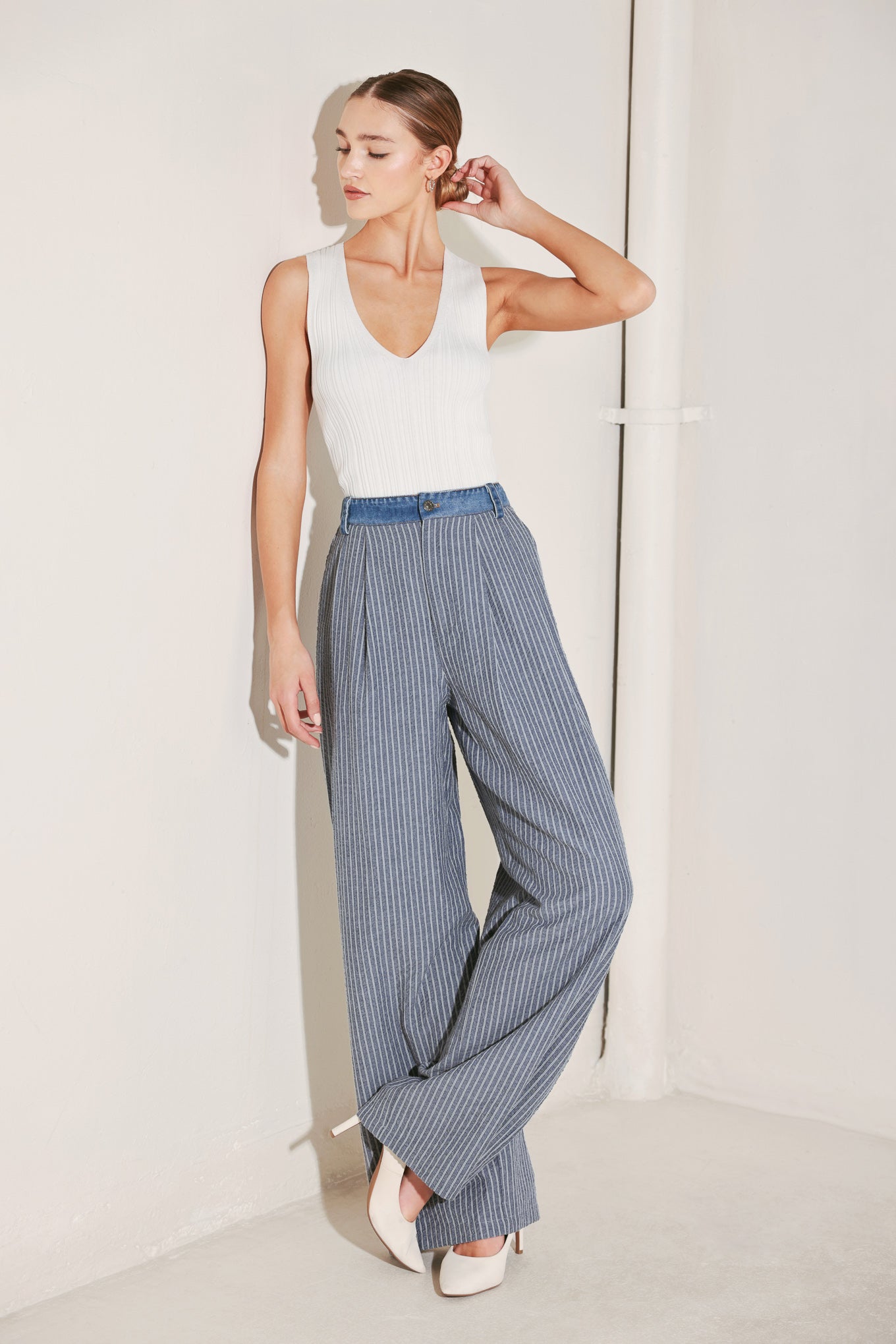 Pinstripe seersucker wide leg pants with denim waistband styled with neutral top