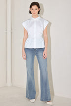 White peplum corset waist blouse styled with light wash denim