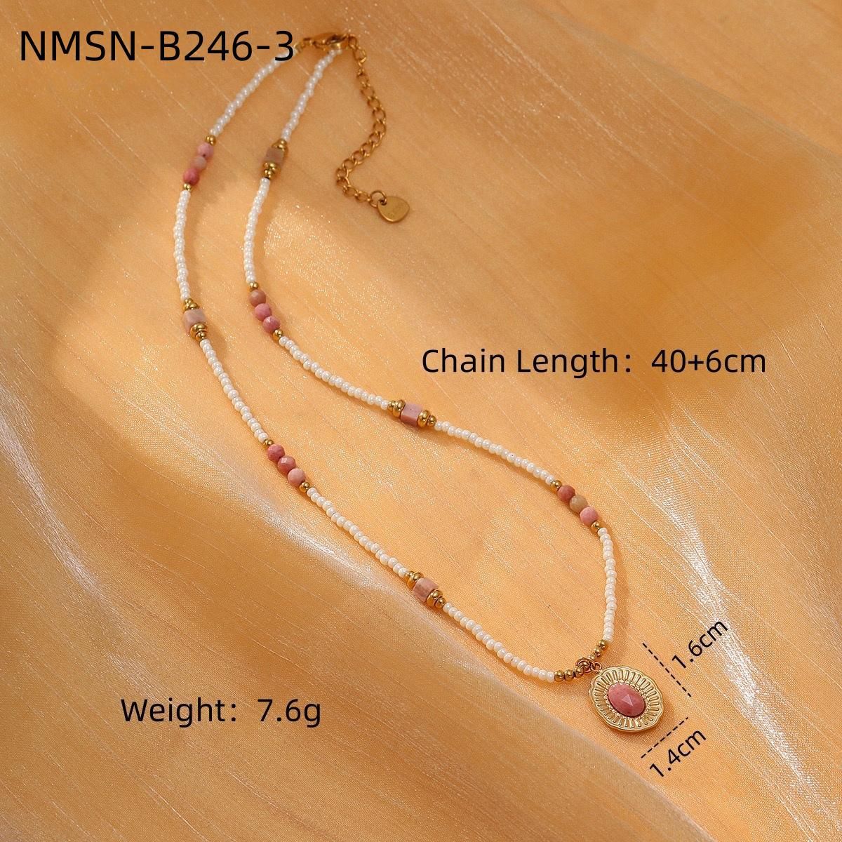 Necklace with pink and gold beads on a beige background, showing chain length, weight, and measurements.