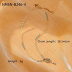 Necklace with turquoise beads and gold accents on a wooden surface, showing chain length and weight.