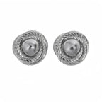 Silver spiral statement stud earrings with textured detailing