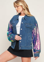 Stylish women’s denim jacket with bold sequin sleeves worn with black skirt modern statement outerwear